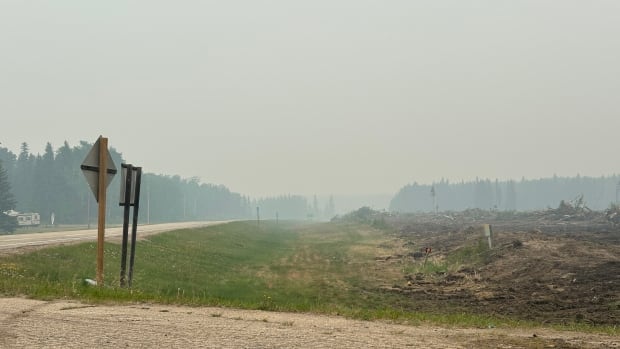 Smoke can be seen on route 120 near Candle Lake, the community is under a voluntary evacuation order but is preparing for an imminent fire threat.
